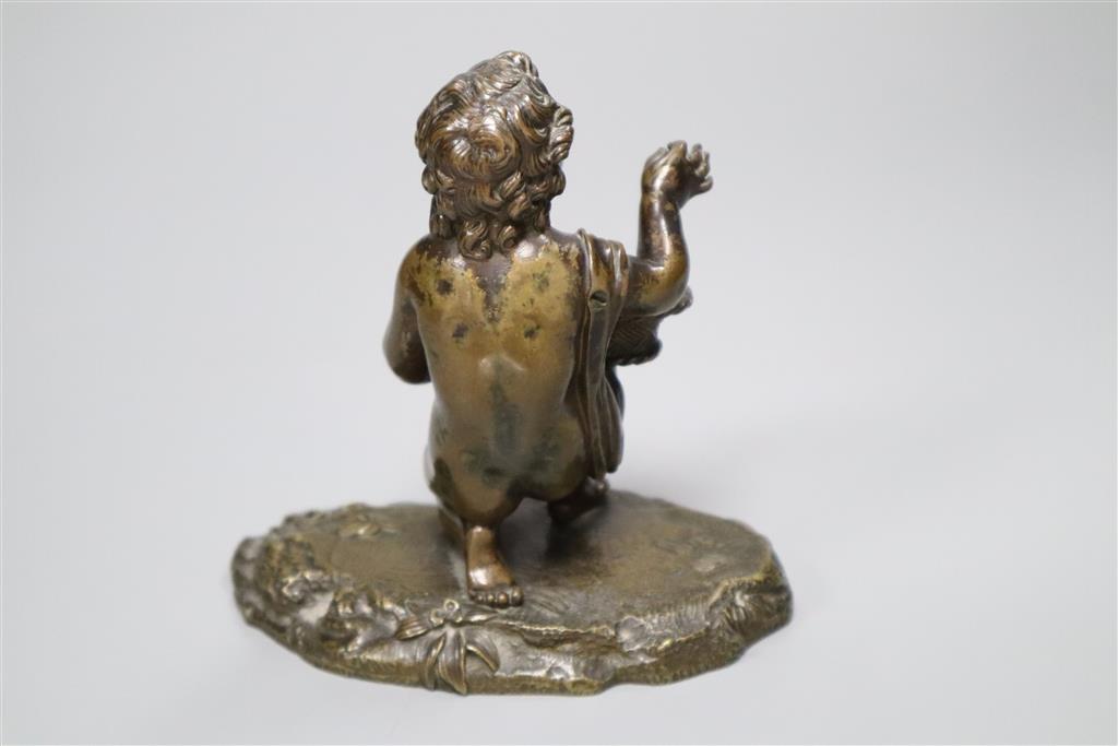 A small Victorian bronze figure of a child and basket, height 12.5cm